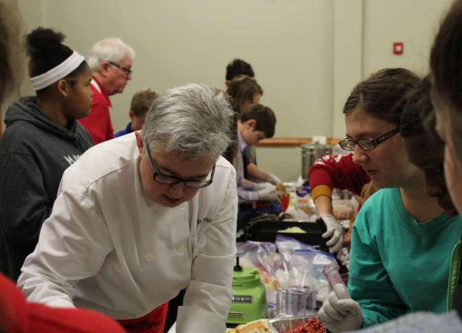 Chef teaches young adult cooking class