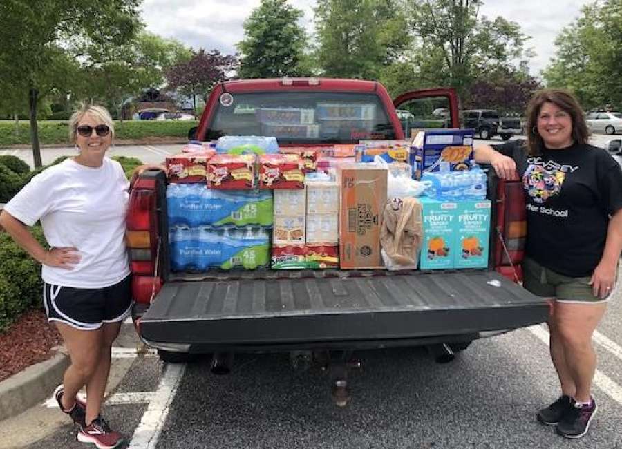 Odyssey Charter donates food for Backpack Buddies