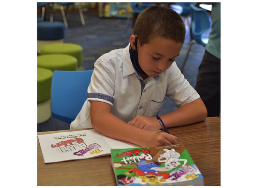 Books by Share Your Story winners donated to school libraries