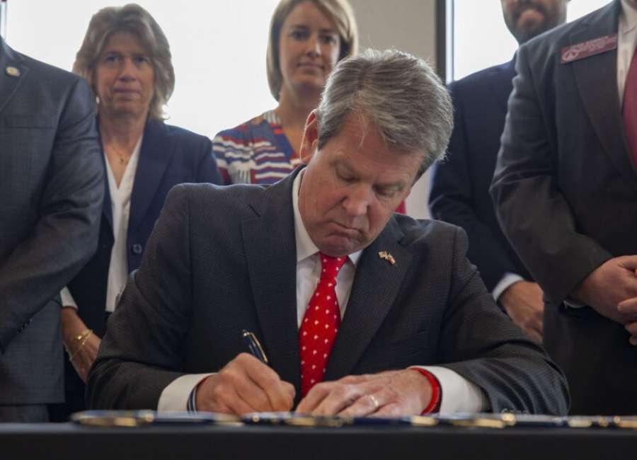 Kemp signs business bills in Cobb County ceremony