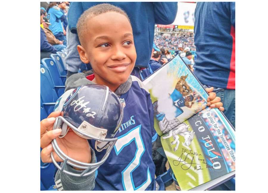 Third-grader attends Titans game, gets signed gear from hero