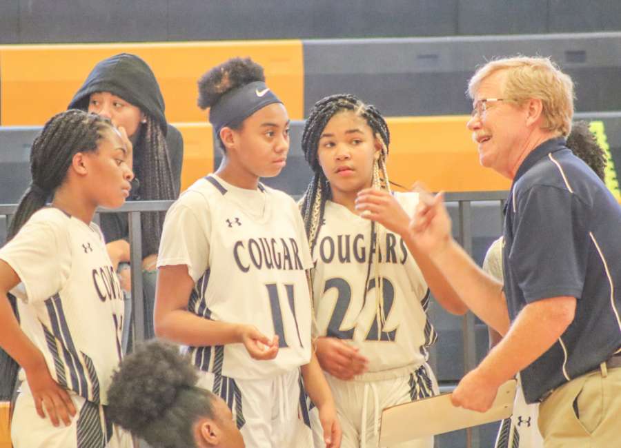 Evans, Madras split middle school basketball games